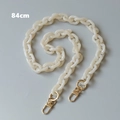Detailed view of 84cm cream acrylic crossbody strap with golden metal lobster clasps - 84cm / Jelly White