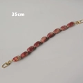 Dettaglio catena borsa 35cm con perle in resina marmorizzata e moschettoni in metallo dorato - 35cm / Perle Ovali Rosse