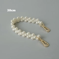 Detailweergave van 30 cm dubbele crèmewitte parelketting met gouden karabijnsluitingen - 30cm