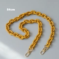 Detail showing 84cm ginger resin chain with light gold metal clasps for cross-body bags - 84cm / Yellow
