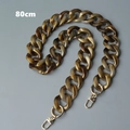 Detalle de cadena para bolso de 80cm en resina acrílica ámbar con cierres dorados - 80cm / Marrón