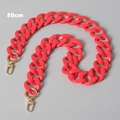 Detailed macro view of 80cm bright pink acrylic chain strap with golden lobster clasps - Red 80cm