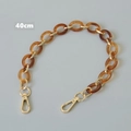 Detalle de cadena de bolso de 40cm en resina ámbar con cierres de langosta dorados - Ámbar 40CM