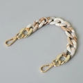 Detail view of marble resin fishbone chain with gold metal lobster clasps for bags - 28cm / Beige