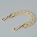 Close-up of translucent amber acrylic flat curb chain with gold-tone metal lobster clasps - 28cm / Transparent Orange
