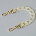 Detail view of chunky white marble acrylic links and golden metal lobster clasps - 28cm / Off White