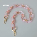 Dettaglio della tracolla in acrilico rosa da 60cm con anelli dorati e chiusure a moschettone - Versione Media / Rosa