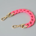 Macro shot of bright pink acrylic fishbone chain with golden lobster clasps for bags - 28cm / Rose Red