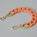 Detail of bright orange resin fishbone chain with shiny gold metal lobster clasps - 28cm / Orange