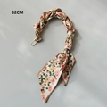 Close-up of 32cm silk scarf handbag chain with floral pattern and gold metal rings - Beige Scarf with Orange Pink Floral / 32cm