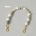 Detail van een handgemaakte kleurrijke kralenriem van 38cm met gouden karabijnsluiting - Stijl 1-Groen en Wit