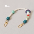 Detail showing 32cm colorful beaded handbag chain with secure gold lobster clasps - 32cm