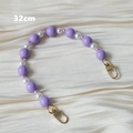 Detailed view of a 32cm candy-colored acrylic bead strap with gold metal clasps - 32cm Handle Style / Purple