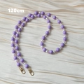 Detail of 120cm purple acrylic bead chain with gold lobster clasps on satin background - 120cm Crossbody Style / Purple