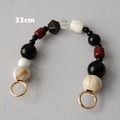 Detalle de la cadena para bolso de 33 cm de resina con anillos de resorte dorados - Estilo de Bloque de Color Mármol Rojo Negro
