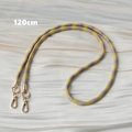 Detail showing 120cm purple and yellow woven crossbody strap with gold metal lobster clasps - Purple and Yellow Spiral Colorblock (Style 8)