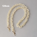 Detailed view of 120cm cream acrylic bag chain with golden metal lobster clasps - 120cm / Apricot