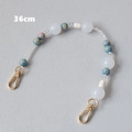 Dettaglio tracolla in perle acriliche da 36 cm con perle marmorizzate blu e chiusure dorate - 36CM / Blu