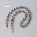 Close-up of 85cm translucent smoky gray acrylic bag chain with golden metal lobster clasps - 85cm / Gray