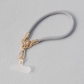 Détail de cordon de téléphone tressé gris avec attaches dorées et insert transparent - Grey Round Cord (Style 21)