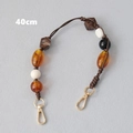 Detail view of 40cm acrylic beaded strap with amber beads and gold metal hooks - Amber (40cm)