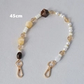 Detalle de correa de bolso de 45cm con perlas de acrílico ámbar y cierres de langosta oro - 45cm