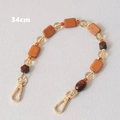 Detail view of a 34cm colorful wooden and acrylic bead bag strap with gold metal hooks - Coffee Brown Wood Bead Combination (Style 1)