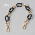 Detail of 32cm bag strap chain with alternating gold metal rings and black resin links - 32cm / Black