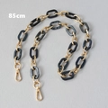 Detail of 85cm replacement bag strap with black marble resin rings and gold metal links - 85cm / Black