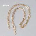 Detailed view of 120cm gold metal and cream acrylic link chain with lobster clasps - 120cm / Apricot