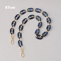 Detail view of 87cm dark blue marble resin bag strap with gold metal lobster clasps - 87cm / Blue