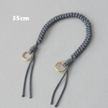 Detailed view of 35cm grey braided wax rope bag handle with gold circular metal rings - Gray