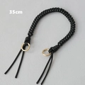 Detail of 35cm black wax rope woven handbag handle with golden metal rings - Black
