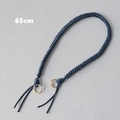 Dettaglio del manico in corda intrecciata blu scuro da 65cm con anelli dorati per borse - Blu