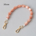 Detail of 35cm pink opal resin bag chain with gold spacers and lobster clasps - Pink with Gold Beads