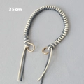 Detail of 35cm woven gray and beige rope handbag strap with gold metal ring buckles - Grey and White