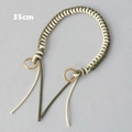 Detail of 35cm hand-woven green and cream wax rope bag strap with gold spring rings - Green and White