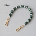 Detail of 35cm green marble resin chain with gold lobster clasps and white bead spacers - Green Acrylic Style