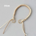 Detailed 35cm braided leather bag strap with gold metal rings in beige and cream - Khaki and White