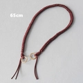 Dettaglio della catena per borsa in corda intrecciata rosso scuro 65cm con anelli oro - Rosso