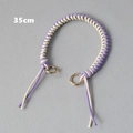 Detail view of 35cm purple and white braided rope handbag chain with gold rings - Purple and White