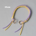 Detail view of a 35cm purple and yellow woven bag strap with golden metal rings - Purple Yellow Patchwork