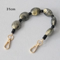 Close-up of a 31cm grey marble acrylic bead chain strap with gold metal lobster clasps - 31cm