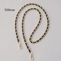 Close-up of 120cm black leather and gold metal interwoven chain strap with lobster clasps - Black