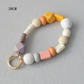 Close-up of 28cm colorful acrylic beaded phone strap with purple leopard print and gold clasp - Purple Leopard Print Dynamic Style