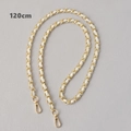 Close-up of 120cm gold chain strap with white leather weaving and lobster clasps - White