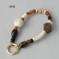 Detail of 28cm mixed acrylic beads with marble textures and golden metal spring clasp - Multi-material Vintage Mixed Style