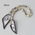 Close-up of a 60cm gold chain strap woven with a black and white floral silk scarf - Black White Letter Floral (Gold Chain)