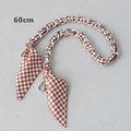 Close-up of a 60cm silver chain bag strap woven with brown checkered silk scarf fabric - Brown White Checkerboard (Silver Chain)
