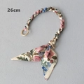 Detail view of 26cm scarf woven handbag strap with floral patterns and gold spring clasps - Pink and Blue Floral